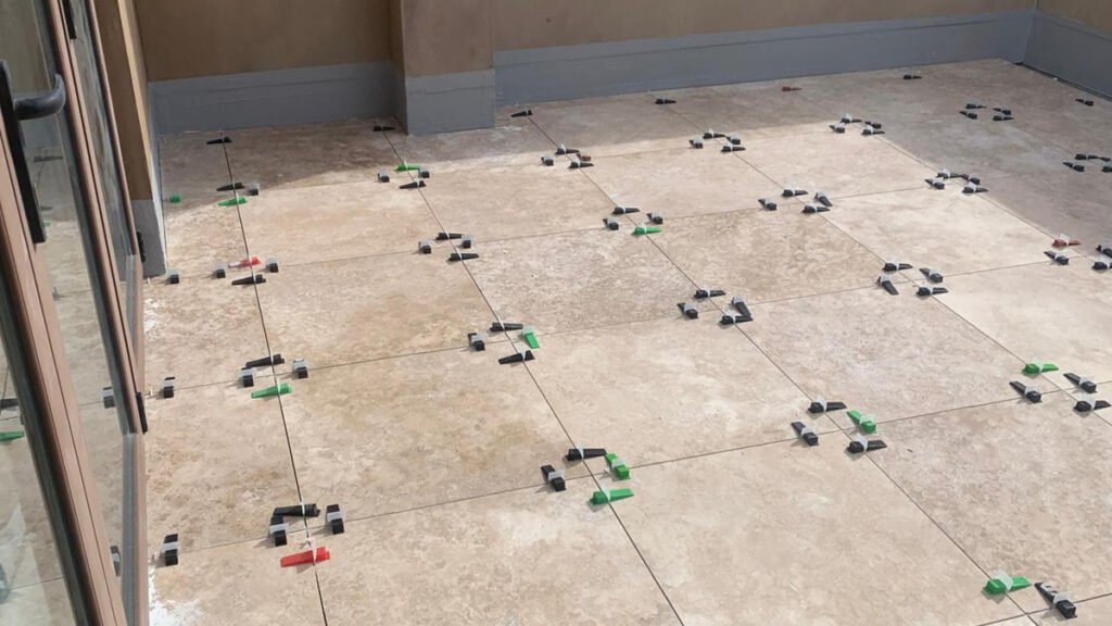 Peninsula working on tiles